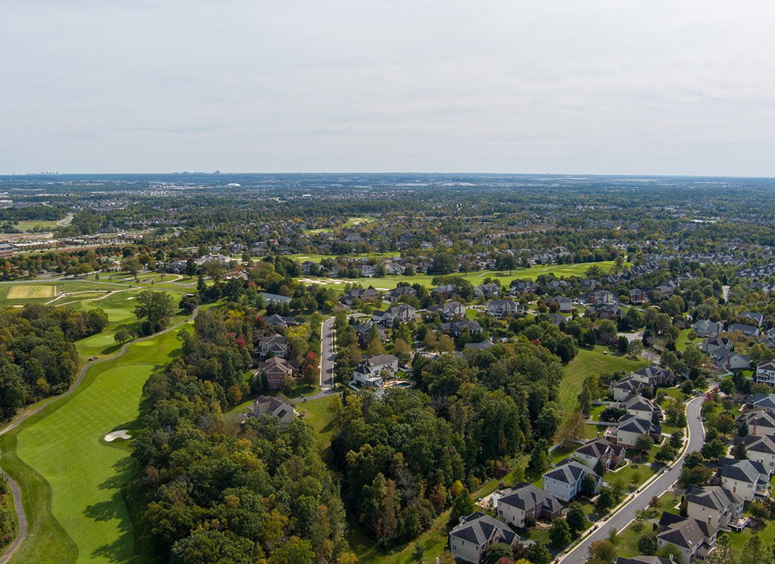 South Hill, VA - Aerial View of Virginia Homes Displaying Homes, Trees and a Golf Course on a Sunny Day